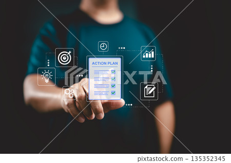Businessman pointing at digital action plan with icons for strategy, time management, and growth Businessman pointing at digital action plan with icons for strategy, time management, and growth 135352345