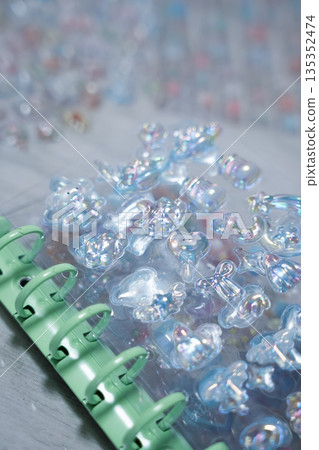 A girl putting 3D stickers into a sticker book 135352474