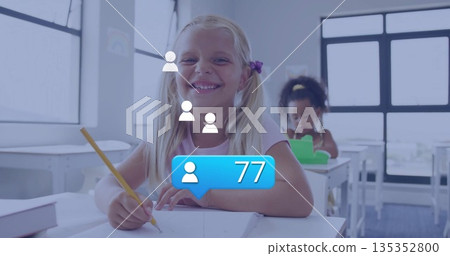 Writing girl with blonde pigtails working with yellow pencil at classroom desk, with notifications Writing girl with blonde pigtails working with yellow pencil at classroom desk, with notifications 135352800