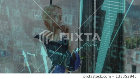 Contemplating businesswoman analyzing financial charts on office glass window, city skyline 135352943