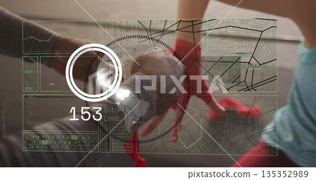 Training sparring partners punching with red boxing gloves in gym, with holographic display Training sparring partners punching with red boxing gloves in gym, with holographic display 135352989