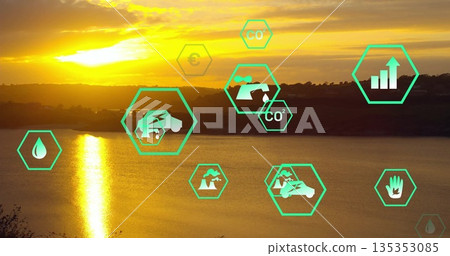 Glowing sun disc casting bright reflection on lake at sunset, with neon-green hex icons, copy space 135353085