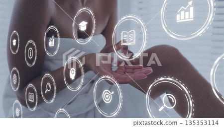 Applying body cream woman wrapped in white towel sitting on spa bench, with floating digital icons Applying body cream woman wrapped in white towel sitting on spa bench, with floating digital icons 135353114