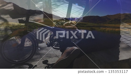 Seated man driving power wheelchair on tile plaza, with low stone bench and mountain lake backdrop Seated man driving power wheelchair on tile plaza, with low stone bench and mountain lake backdrop 135353117