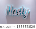 Nasty neon sign illuminated against a light wall in urban interior design space at Changi Airport Singapore 135353629