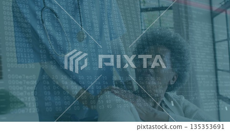 Examining binary data overlay senior woman in wheelchair and adult daughter collaborating in office Examining binary data overlay senior woman in wheelchair and adult daughter collaborating in office 135353691