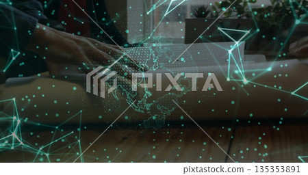 Unrolling blueprint with hands wearing shirt on office table near window, with holographic network 135353891