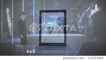 Observing businesswoman analyzing holographic world map in tech lab with digital table, copy space 135353903