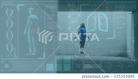Jumping athlete in sportswear jumping rope in parking garage, with augmented reality graphics Jumping athlete in sportswear jumping rope in parking garage, with augmented reality graphics 135353995