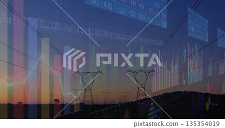 Displaying high-voltage towers crossing rural scene at dusk, with guardrail and financial charts 135354019