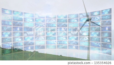 Rotating wind turbine on grassy hill, with curved screen display showing digital data, copy space Rotating wind turbine on grassy hill, with curved screen display showing digital data, copy space 135354026