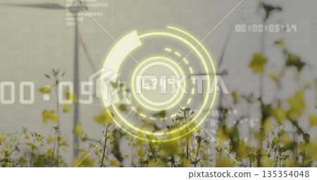 AR gauge displaying readout 6749 and timecode overlays over canola field with two wind turbines AR gauge displaying readout 6749 and timecode overlays over canola field with two wind turbines 135354048