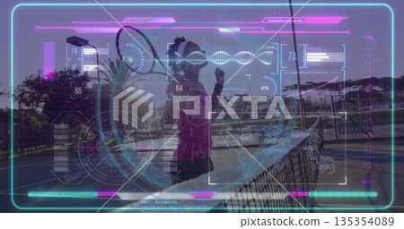Gripping tennis racket in magenta top activating AR display on outdoor court with net, showing data Gripping tennis racket in magenta top activating AR display on outdoor court with net, showing data 135354089