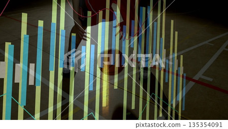 Basketball player in red jersey dribbling basketball on court, with translucent bar chart overlay 135354091