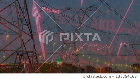 Displaying high-voltage towers and lines along highway at dusk, with red market graph overlay 135354168