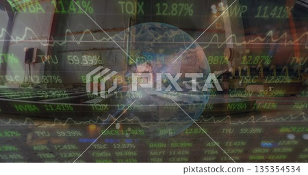 Standing male traveler holding rolling suitcase at gate near windows with stock ticker overlay 135354534