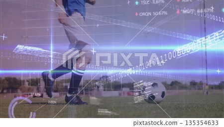 Female soccer player in blue jersey and cleats kicking soccer ball on field, with digital overlay Female soccer player in blue jersey and cleats kicking soccer ball on field, with digital overlay 135354633