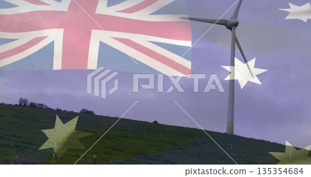 Standing wind turbine towering on rural grassy hill, with Australian flag overlay, copy space Standing wind turbine towering on rural grassy hill, with Australian flag overlay, copy space 135354684