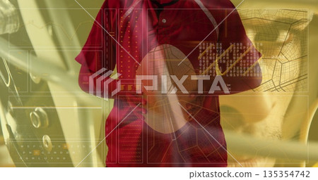 Standing male wearing red jacket crossing arms in car cabin, digital panels showing charts 135354742