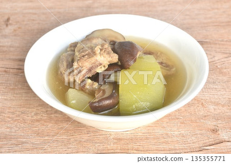 boiled winter melon with pork bone and black mushroom soup on bowl 135355771