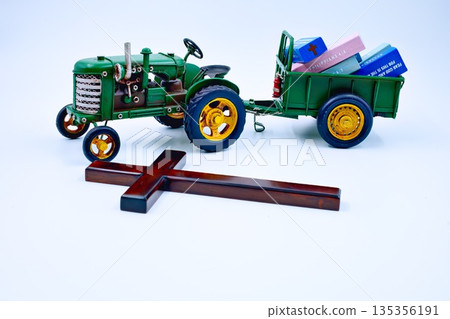 Green Tractor And Trailer Full of Bible Verse Blocks Wooden Cross Front Green Tractor And Trailer Full of Bible Verse Blocks Wooden Cross Front 135356191