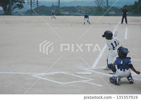 A young baseball player who is working hard to become a professional baseball player A young baseball player who is working hard to become a professional baseball player 135357919