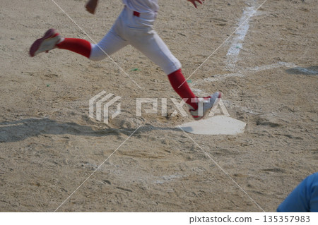 A young baseball player who is working hard to become a professional baseball player A young baseball player who is working hard to become a professional baseball player 135357983