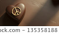 Luxury heart-shaped chocolate with a gold peace sign and copy space 135358188