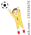 Boy goalkeeper defending in a soccer game 135358476