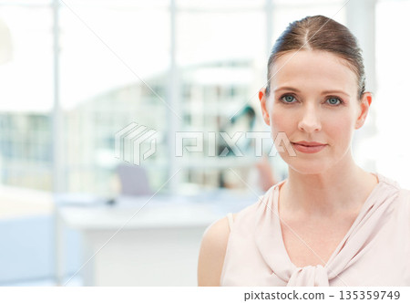 Businesswoman in sleeveless blouse standing by reception counter in office with laptop, copy space 135359749