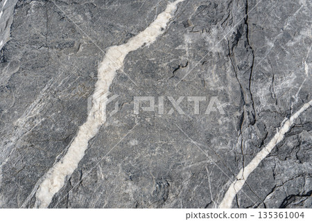 Natural stone surface with white mineral veins texture Natural stone surface with white mineral veins texture 135361004