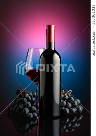Red wine and juicy blue grapes. Red wine and juicy blue grapes. 135361032