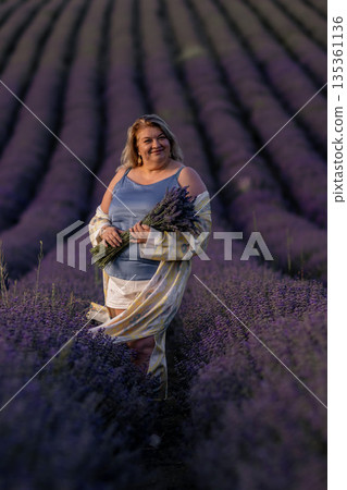 Lavender Fields Provence Woman Photography: Summer photoshoot showcasing a woman amidst blooming purple lavender in Provence, France. 135361136
