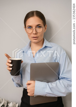 Businesswoman laptop coffee standing professional portrait corporate copy space 135362484