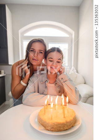 Birthday Cake, Mother, Daughter - Two women celebrating a birthday with a cake. 135363032