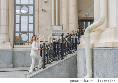 Woman White Suit Stairs Building Woman White Suit Stairs Building 135363177