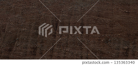 Dry brown earth surface texture showing cracked ground Dry brown earth surface texture showing cracked ground 135363340