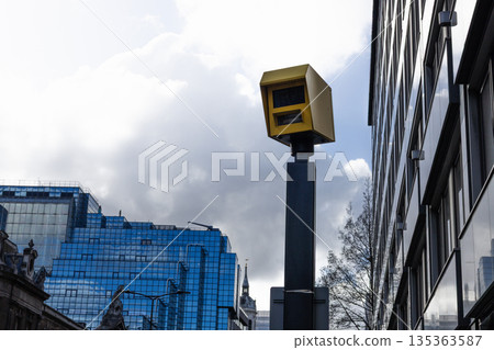Speed camera monitoring city traffic and enforcing road safety 135363587
