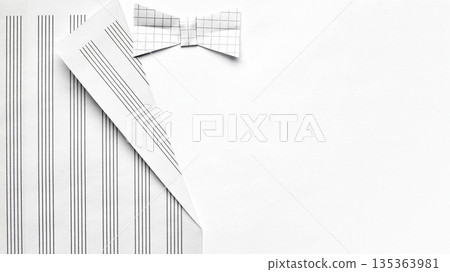 Paper shirt with bow tie folded from grid paper flat lay. 135363981