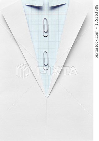 Paper shirt made from notebook sheet with paper clips flat lay. Paper shirt made from notebook sheet with paper clips flat lay. 135363988