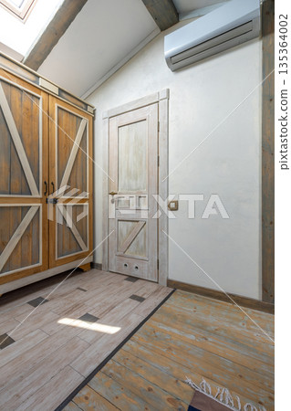 Rustic barn doors wardrobe room with wooden sliding panels air conditioner beams 135364002