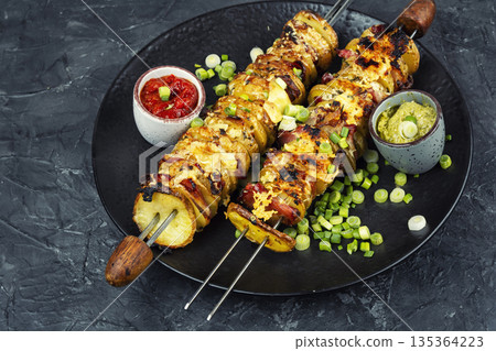 Potato skewers wrapped with bacon Potato skewers wrapped with bacon 135364223