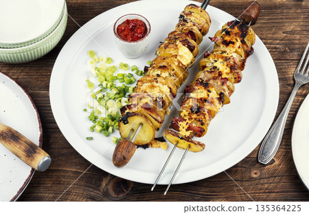 Baked Potato and Bacon Kebabs 135364225
