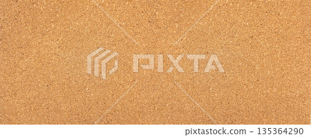 Cork board surface providing natural brown texture background 135364290