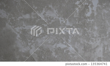 Gray primed wall with abstract decorative plaster pattern as textured monochrome background full frame, simple empty textured blank in monochrome gray with spotted abstraction 135364741