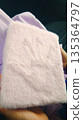 Close-up of a Pink Furry Notebook on a Car Seat in Natural Light 135364797