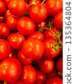 Fresh Red Tomatoes on Vine in Bright Market Display for Cooking and Produce Photos 135364804