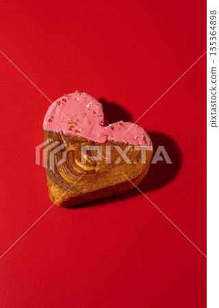 Creative ides Valentine's Day love symbol Holiday celebration Heart shaped flavor croissants on red background with copy space. Puff pastry new trendy sweet dessert bakery. Creamy dough Creative ides Valentine's Day love symbol Holiday celebration Heart shaped flavor croissants on red background with copy space. Puff pastry new trendy sweet dessert bakery. Creamy dough 135364898