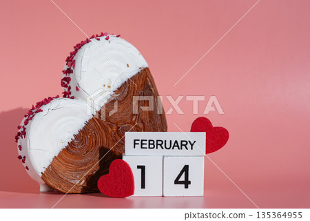 14 FEBRUARY calendar date Valentine's Day holiday Heart shaped white chocolate croissant on pink background with copy space. Puff pastry new trendy sweet dessert bakery. Creamy dough 14 FEBRUARY calendar date Valentine's Day holiday Heart shaped white chocolate croissant on pink background with copy space. Puff pastry new trendy sweet dessert bakery. Creamy dough 135364955