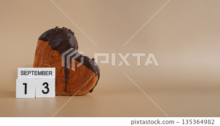 Calendar date 13 September International chocolate day greeting card Delicious fresh croissant topped with colorful flavor Ganache. Creation unique heart shape bakery. Puff pastry holiday love gift 135364982
